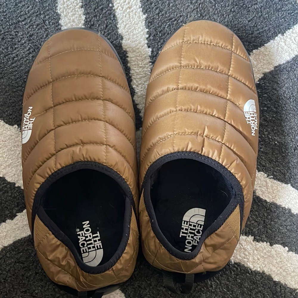 The NorthFace thermoball mules brown puffy down slippers.